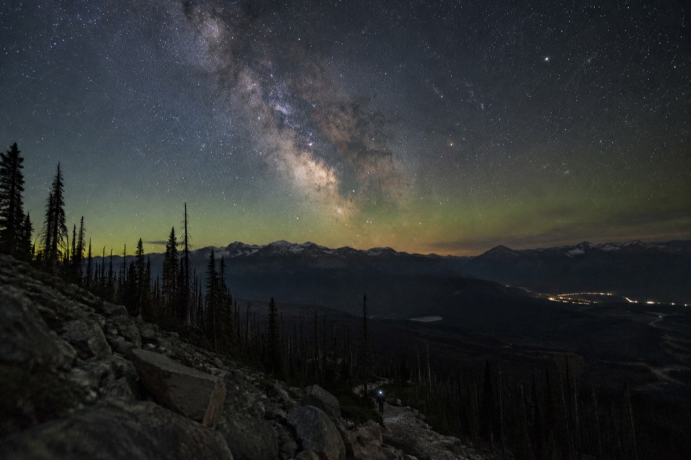 Night sky full of stars above a mountain ridgeline with the Milky Way visible